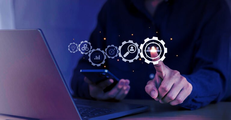 Business professional using laptop and smartphone, interacting with digital icons for continuous support, optimization, analytics, and innovation.