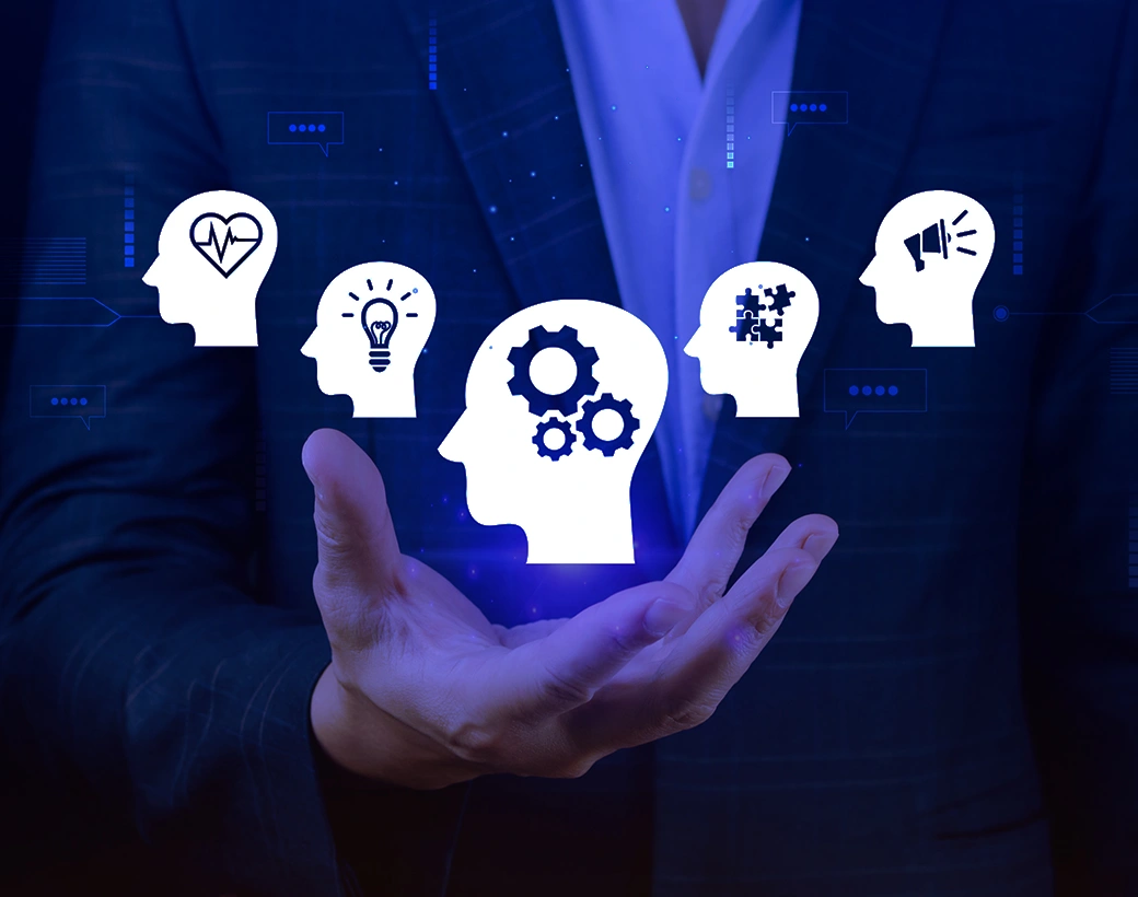 Business professional holding digital icons of human heads with symbols for heart, lightbulb, gears, and megaphone, representing a value-first, no-spam mindset.
