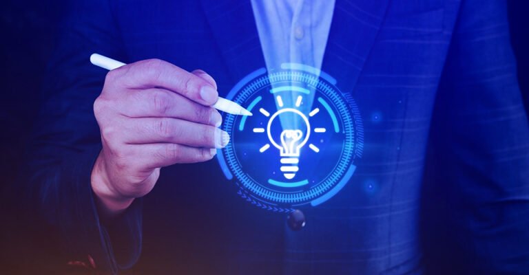 Business professional drawing a glowing digital lightbulb icon with a stylus, symbolizing innovative and effective solutions.